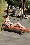 Leggy redhead MILF Sophie Lynx posing for candid bikini photos outdoors