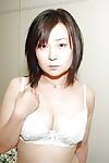 Lusty Japanese MILF strips down and has some pussy vibing fun