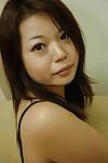 Asian MILF Mami Isoyama undressing and spreading her lower lips in close up