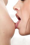 Close ups of amateur lesbians Eve Angel and Lorena Garcia sharing deep kiss