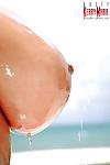 Euro plumper Kerry Marie unveils huge pornstar tits outdoors beside pool