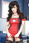 Clothed bitch Lisa Ann is posing in her sexy nurse outfit