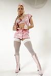 Hot nurse Nicki Hunter stripping off her latex uniform and lingerie