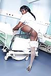 Raunchy ebony nurse with pigtails Jasmine Webb taking off her uniform