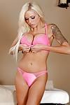 Nina Elle poses in her awesome pink lingerie and playing with clit