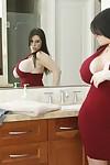 Curvaceous MILF Daphne Rosen slipping on her lacy panties and red dress