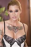 Inked pornstar Kleio Valentien shows off her perfect tits and bald twat