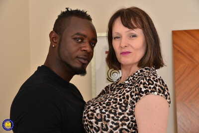 Breasty British housewife humps a ebon man despite the fact hubby is at put into