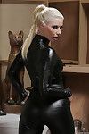 Hot blonde lass Anikka Albrite posing solo in decadent latex uniform