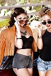 Female-on-female pornstars Ariana Marie and Nicole Aniston lick gentile outdoors