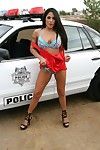 Latina milf is pleasing off dominant lingerie posing outdoor near police car