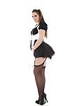 Cute maid Dani Daniels positions in her fantastic uniform and high heels