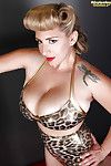 Tattooed blonde September Carrino is demonstrating her enormous major boobs