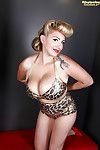 Tattooed blonde September Carrino is demonstrating her enormous major boobs