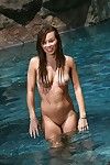 Thong bikini model capri anderson splashes in nature\'s garb in pool