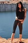 Zoe rush posing outdoors in her crotchless latex pants