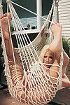 Fairy hottie gina lynn removes clothes in advance of oiling up and posing for the live camera on the c