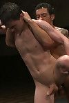 Two studs with big dicks fight naked in oil and the winner fucks the looser.