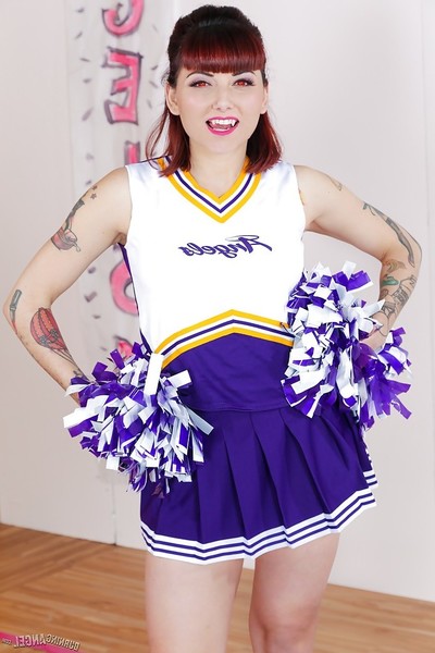 Tattooed schoolgirl cheerleader stripped off for shaved pussy amplifying