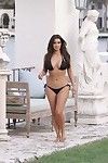 Adolescent celeb kim kardashian posing on the beach