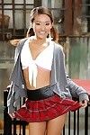 Adolescent Japanese pornstar Alina Li posing seductively in schoolgirl uniform