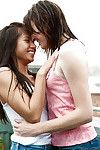 Juvenile teen gals Larissa M and Silvie upload tongue take up with the tongue outdoors