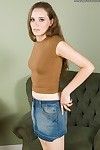 Appealing teen model Nikki modeling clothed in denim petticoat ahead of undressing