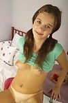 Shy dark hair teen lady shows her compact shiny on top slit
