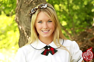 Moist young in super stunning schoolgirl outfit smiles and shows her perspired body