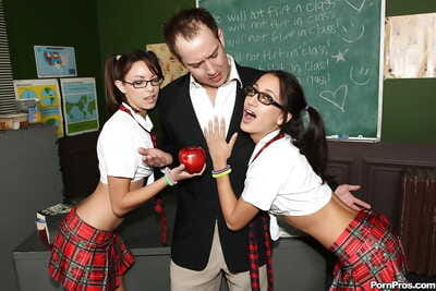 Infant schoolgirls Amia and Danni in glasses attract tutor for smokin\'