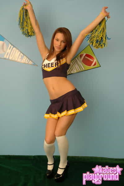 Redhead youthful Kate takes off her cheerleader uniform in a safe for till manner