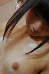 Asian teen babe Yuki Hamatani shows her hairy pussy while handsome a bath