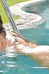 Erotic babe Eva Parcker is posing in the pool essential and masturbating