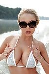 Young and busty Euro babe Mandy I shedding bikini outdoors on motor yacht
