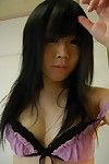 Shy asian teen getting nude and in the same manner stay away from her hairy gash in close up