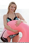 Infant blond with amazing legs takes off bikini for exposed way on inflatable