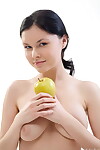 Uncovered young model Gia shows off her supple body with an apple in her hand