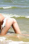 Lean teen-age infant with smooth head cum-hole posing as mother gave birth on the beach
