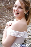 Young angel Danielle posing outdoors in her provocative lace outfit