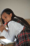 Lewd schoolgirl Ayla Sky jerking off in uniform and socks in the classroom