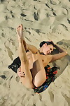 Brown hair doll Marissa A takes her clothes off off her suit & stretches her cunt in the sand