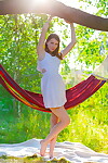 Appealing adolescent Alisa shows her wonderful muff outdoors on a hammock