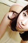 Asian teen Misato Uemoto undressing and exposing her wet hairy cunt