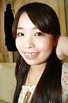 Smiley asian teen in stockings undressing and spreading her hairy pussy lips