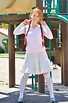 Adolescent redhead in pigtails flashes bawdy cleft at the playground & toys in socks