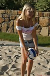 Appealing blond Jana Jordan in a petticoat flashing cleavage at the beach