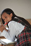 Excited schoolgirl Ayla Sky jacking off in uniform and socks in the classroom