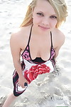 Shy fairy exhibit Stella flashes her youthful milk shakes and muff on the beach