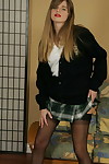 Bawdy schoolgirl winsome off her uniform and posing in underware