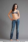 Black haired juvenile Ferrera removes her brassiere and jeans for a as was born modeling session